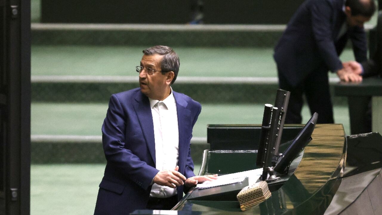 Iranian Finance Minister Abdolnaser Hemmati delivers a speech in parliament during impeachment proceedings against him