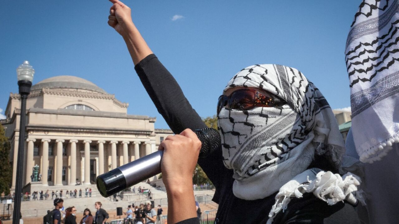 Pro-Palestinian demonstrators march through the Columbia University campus to mark one year of the war between Hamas and Israel in New York City on October 7, 2024