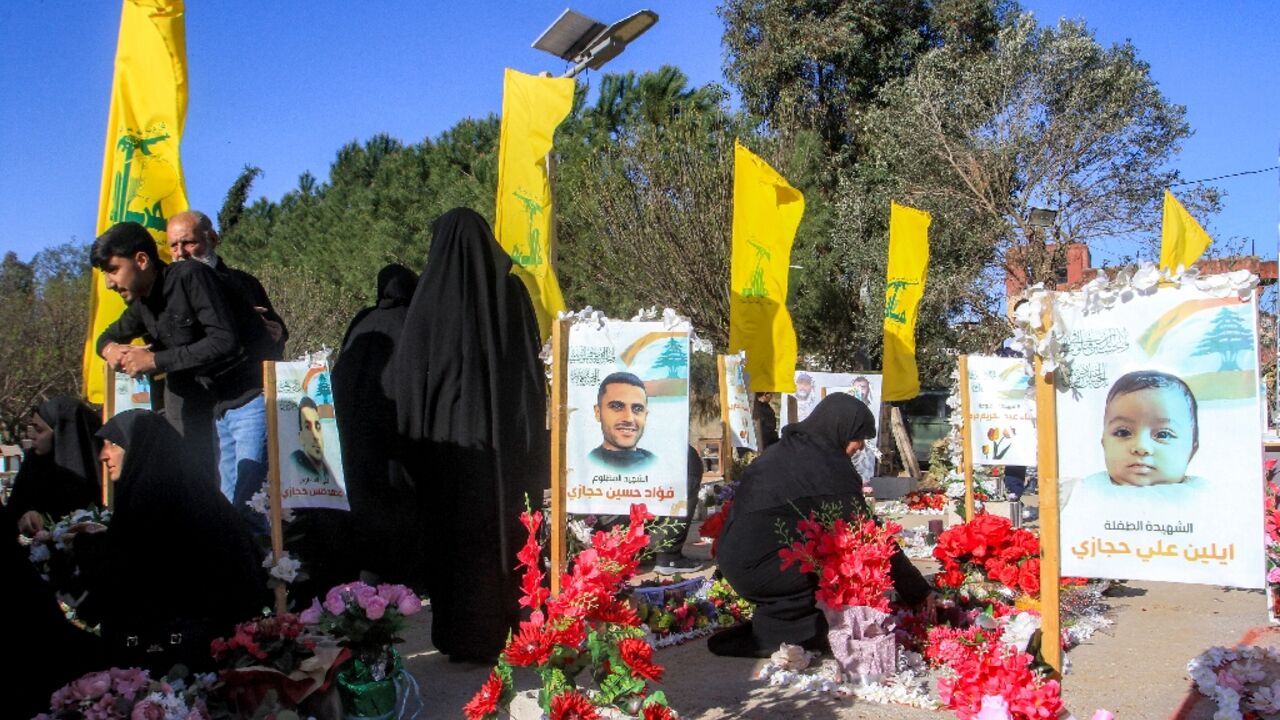 On the first day of Eid al-Fitr, women in Aitaroun, southern Lebanon, mourn at the graves of slain Hezbollah fighters and others killed in the war with Israel
