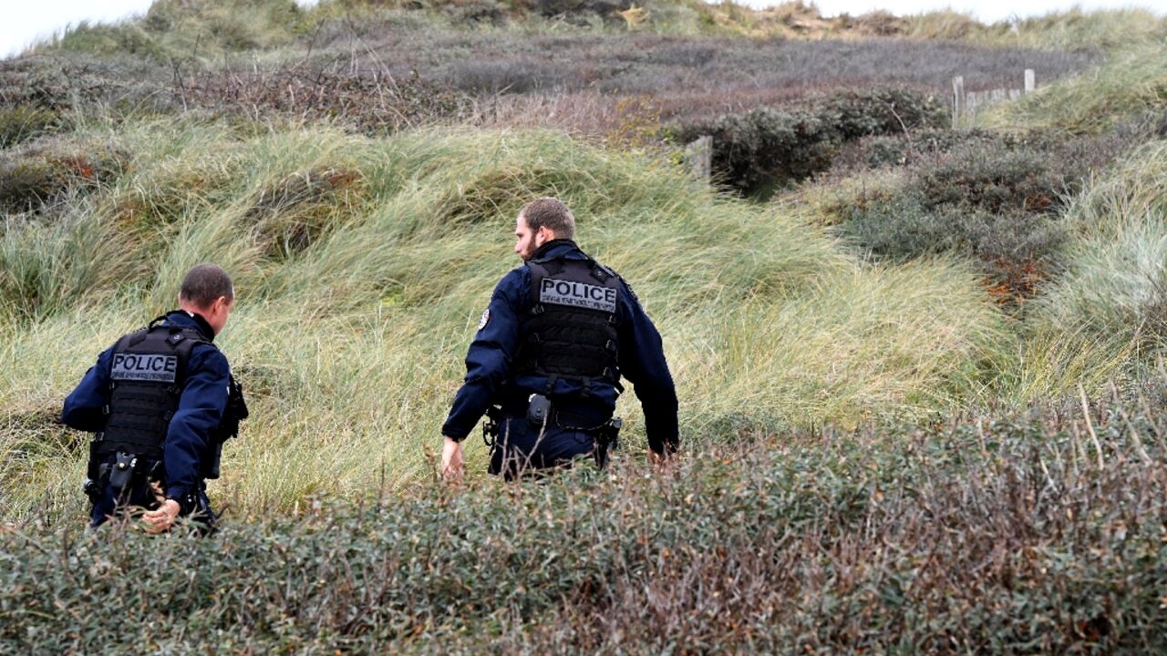 Police patrol Wimereux beach, northern France, in November 2021 after the drowning tragedy