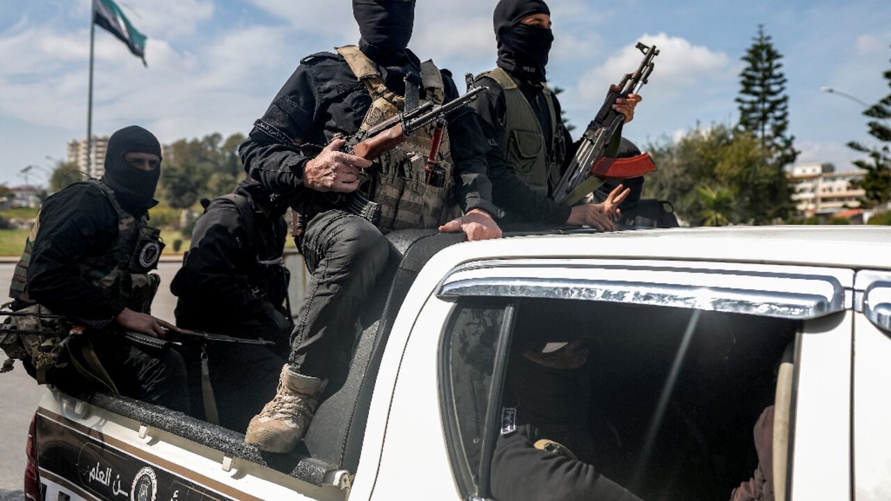 Security forces loyal to the interim Syrian government in the western city of Latakia