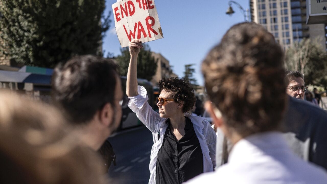 Among the banners held by protesters were many calling on the government to end the war 