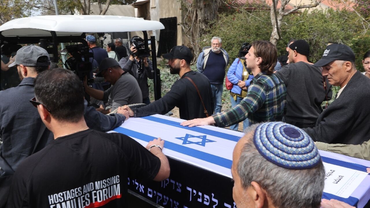 Mourners at the funeral of Danish-Israeli Itzik Elgarat, whose remains have been returned from Gaza