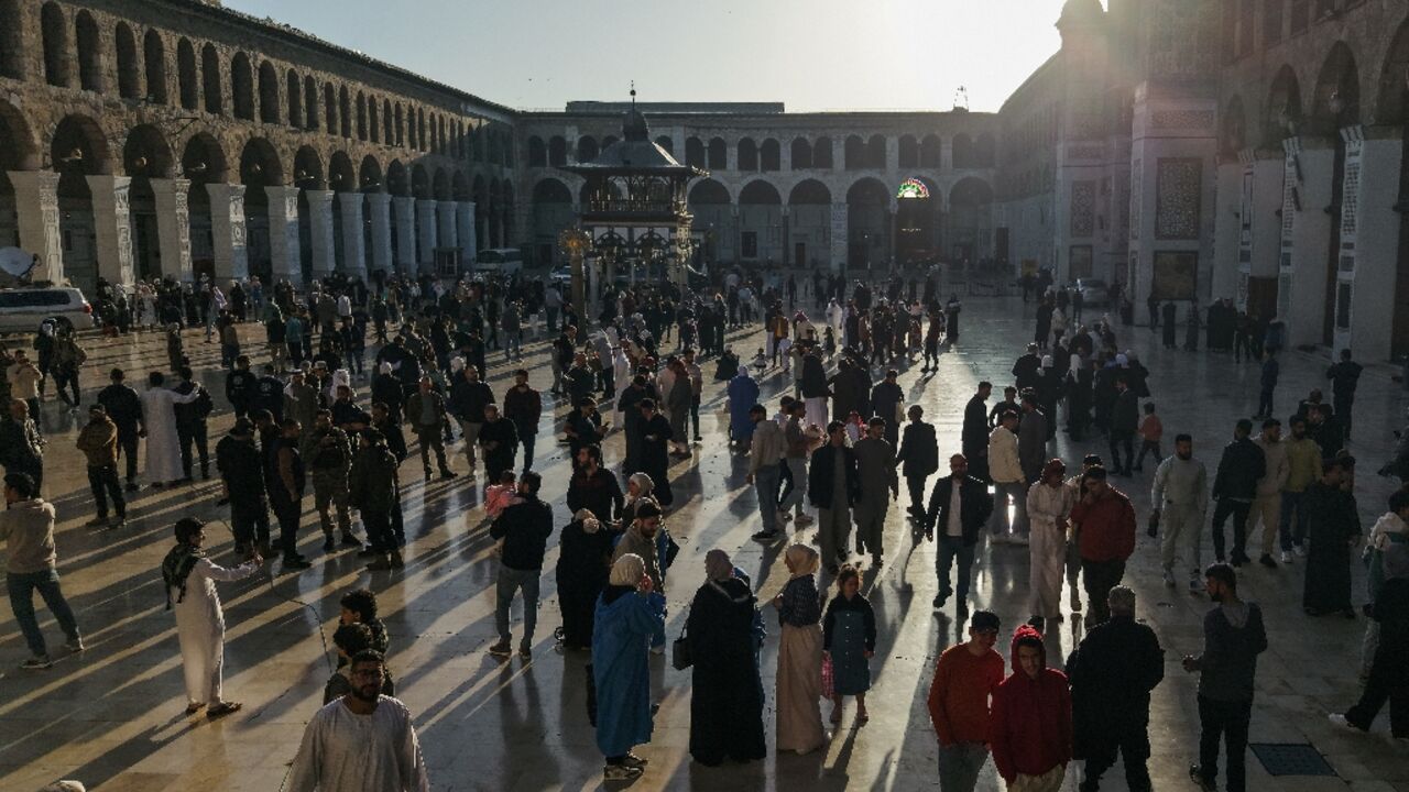 From the early morning hours, crowds of men, women and children flocked to pray at Damascus's historic Umayyad Mosque for Eid