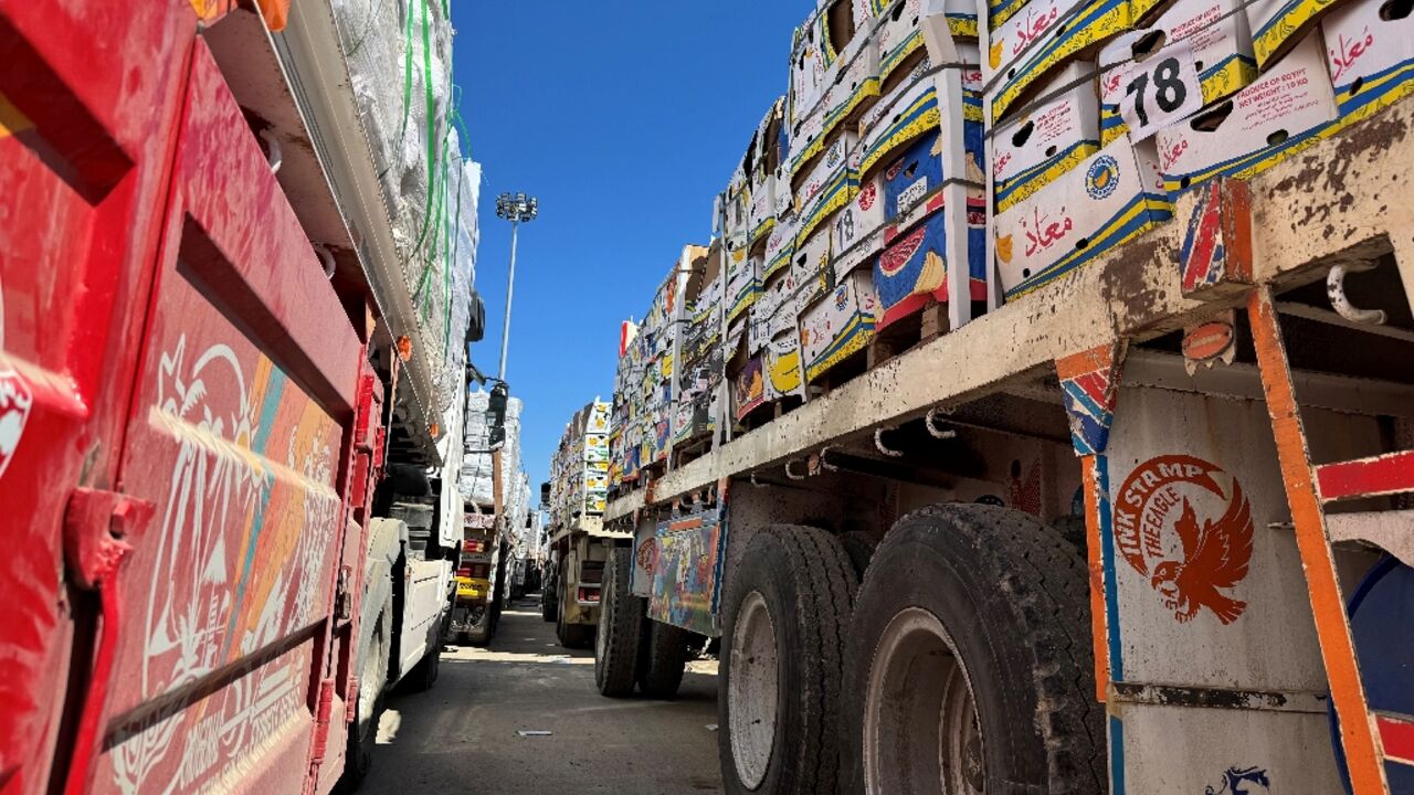 Trucks carrying humanitarian aid line up on the Egyptian side of the Rafah border crossing with the Gaza Strip after Israel suspended the entry of supplies into the Palestinian territory