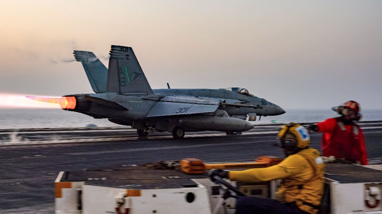 A US military photo shows an F/A-18 Super Hornet warplane taking off from the USS Harry S. Truman aircraft carrier on March 16, 2025