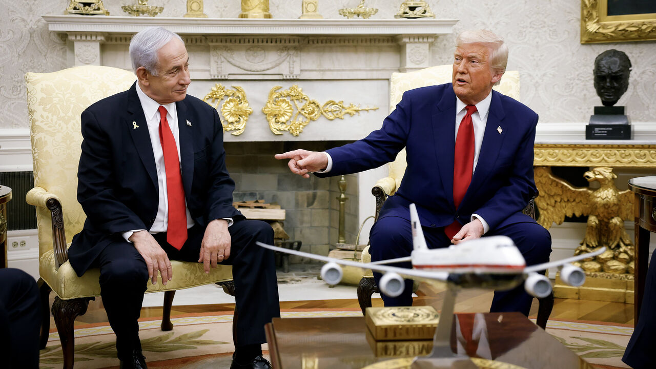 US President Donald Trump (R), accompanied by Israeli Prime Minister Benjamin Netanyahu, speaks during a meeting in the Oval Office of the White House, Washington, April 7, 2025.