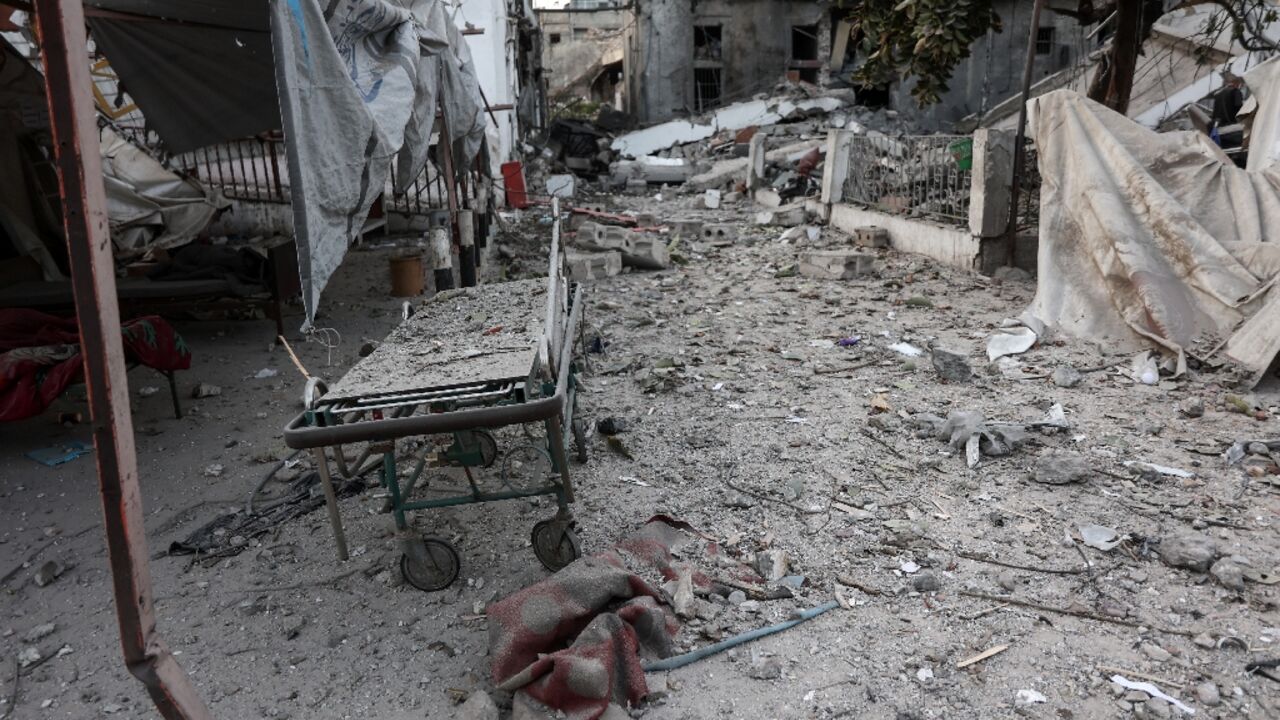 A gurney lies among debris after an Israeli strike on the Al-Ahli hospital, also known as the Baptist or Ahli Arab hospital, in Gaza City 