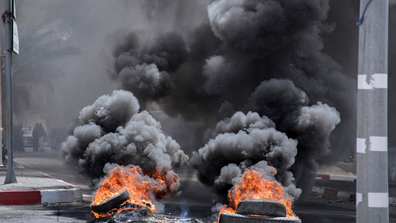 Angry residents block roads in the Tunisian town of Mezzouna after the deaths of three six-formers in a school wall collapse on Monday.