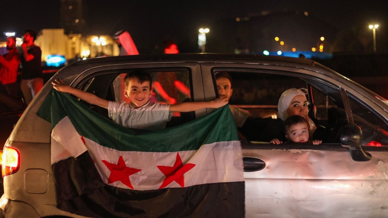 Syrians celebrate President Donald Trump's announcement that he will lift US sanctions on the war-battered country.