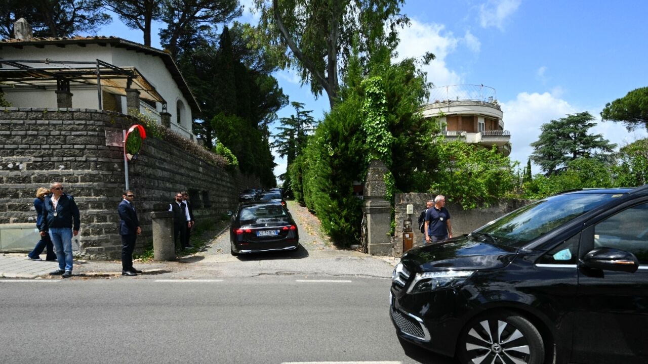 Members of Iran's delegation arrive at the Omani embassy in Rome for the talks