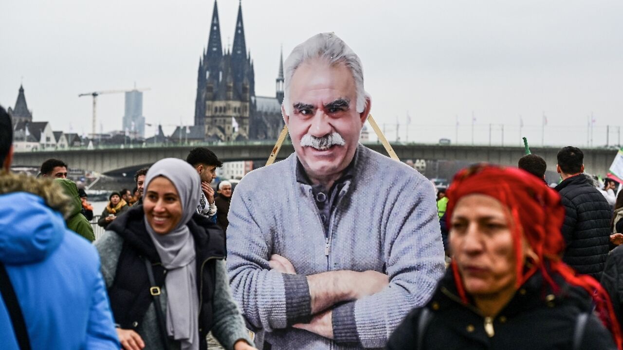 Kurdish demonstrators carry an image of PKK founder Abdullah Ocalan