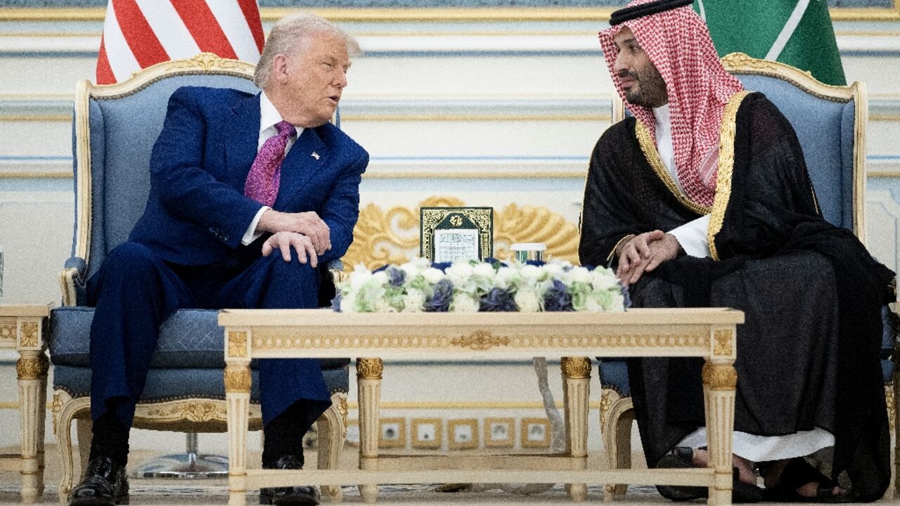US President Donald Trump and the kingdom's Crown Prince Mohammed Bin Salman talk before a coffee ceremony at the Royal Court in Riyadh 