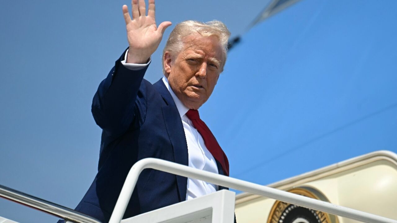 US President Donald Trump waves as he boards Air Force One at Joint Base Andrews in Maryland on April 29, 2025 as he departs for a rally in Michigan to mark his 100th day in office.