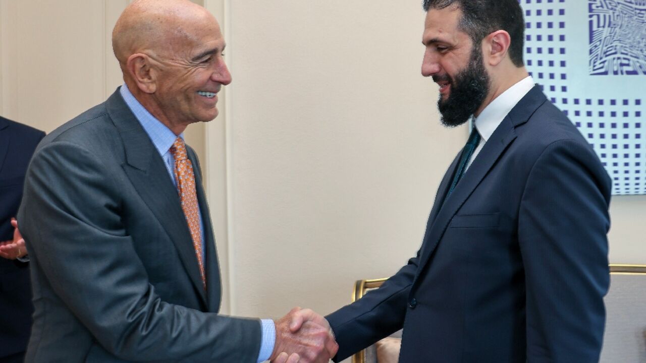 A photograph released by the Turkish foreign ministry on May 24, 2025 shows US Syria envoy Tom Barrack shaking hands with Syria's jihadist-turned-interim President Ahmed al-Sharaa during a meeting in Istanbul