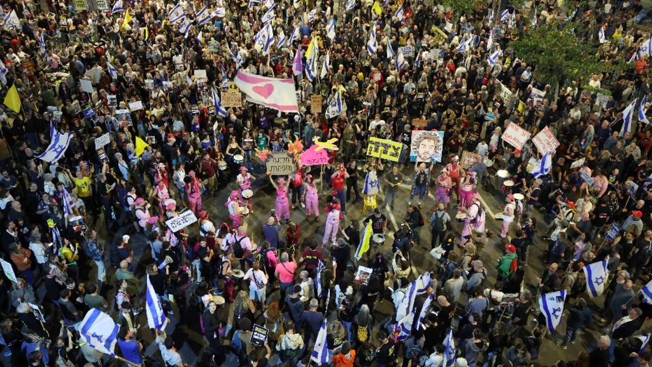 Israelis demonstrate outside the defence ministry in Tel Aviv on Saturday demanding action by the government to bring home the remaining hostages.