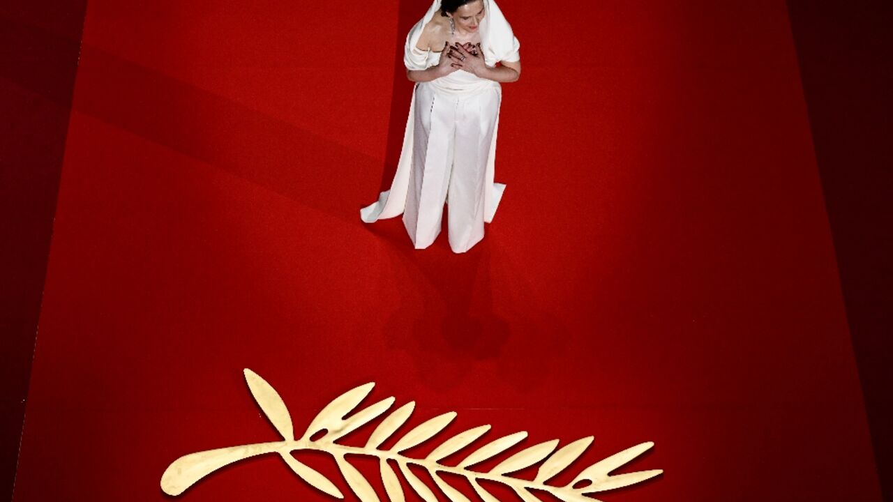 French actress Binoche arrives on stage during the opening ceremony 