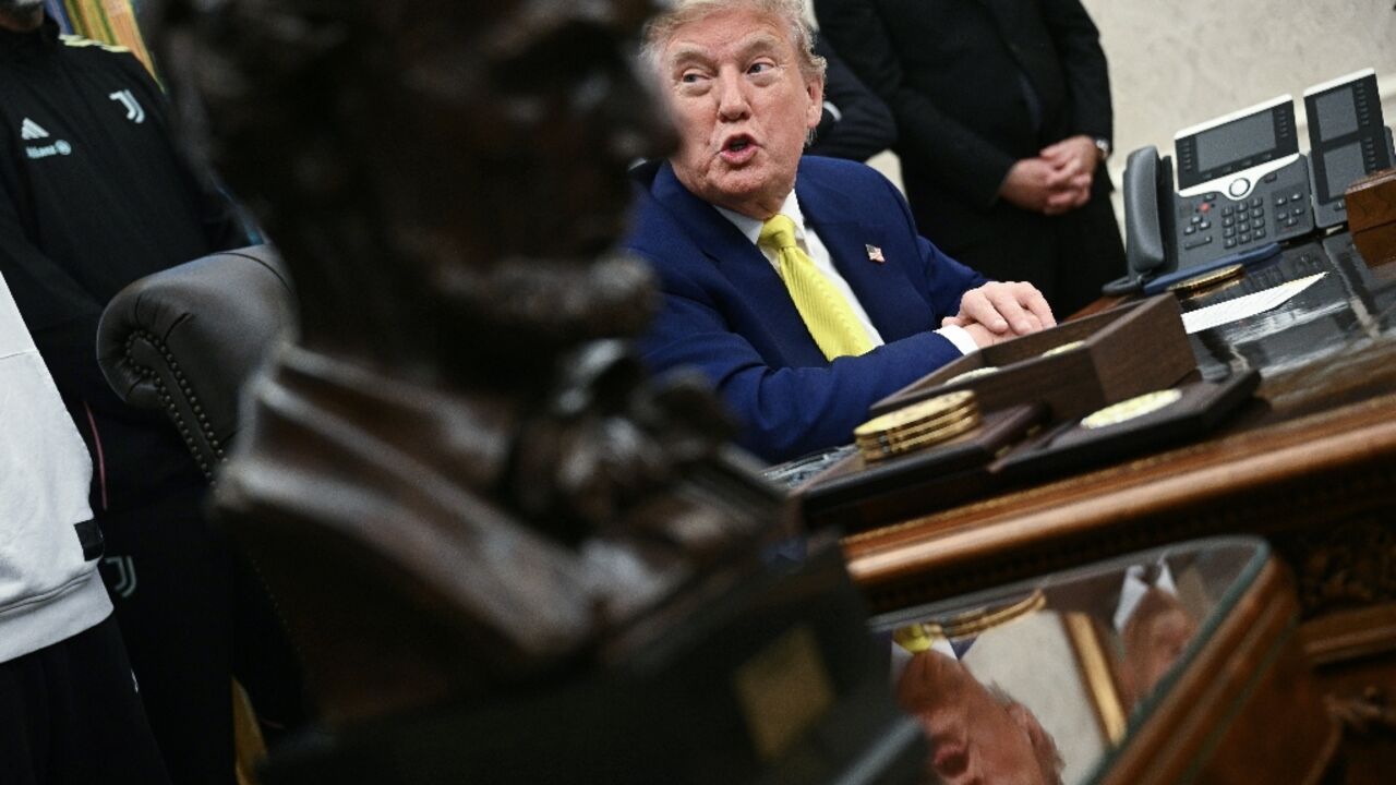 US President Donald Trump speaks to the press in the Oval Office of the White House 