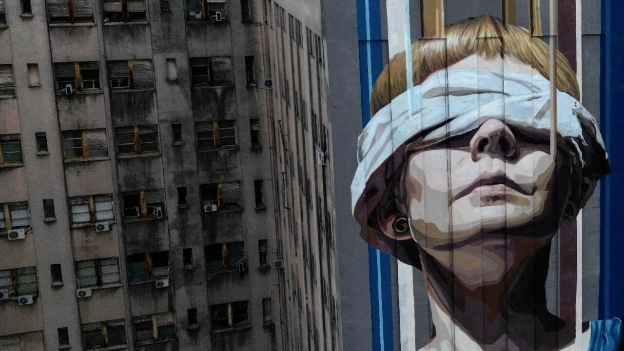A Buenos Aires mural in honor of the 85 dead and more than 300 wounded in an 1994 attack on the Jewish community center of the Mutual Israelite Association of Argentina (AMIA)