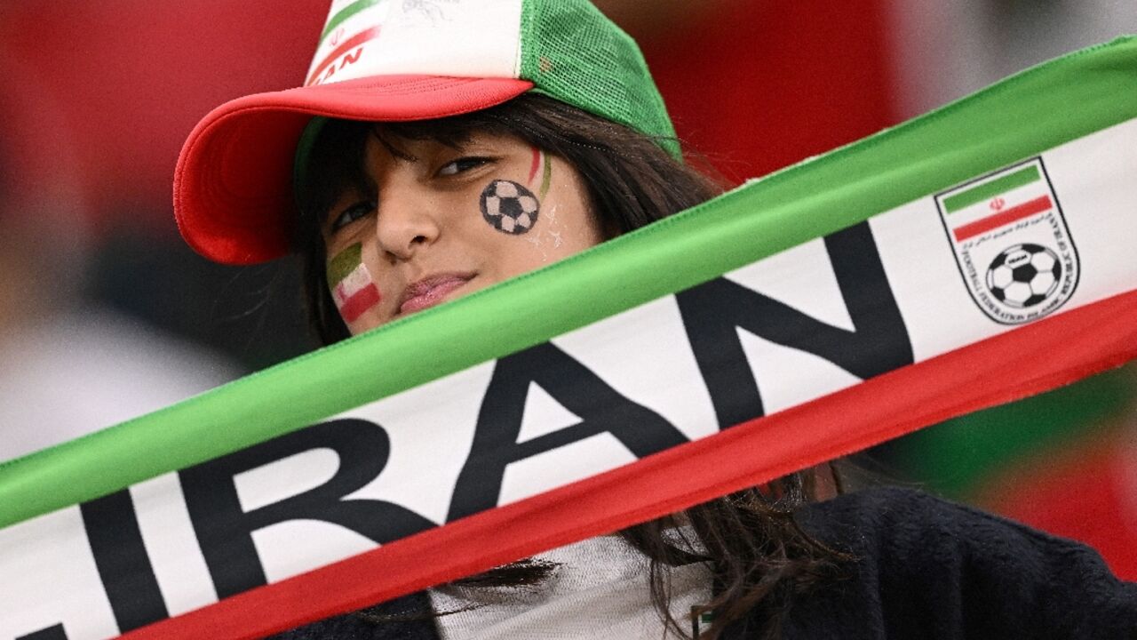 An Iran fan supports her team at a game against the US side at the Qatar 2022 World Cup