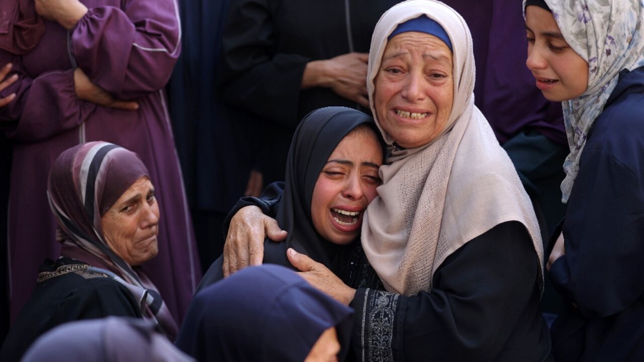 Mourners at a hospital in Gaza City cried over the bodies of people killed in an Israeli strike in nearby Jabalia