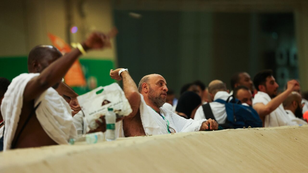 Muslim pilgrims perform the symbolic 'stoning of the devil' ritual as part of the hajj pilgrimage