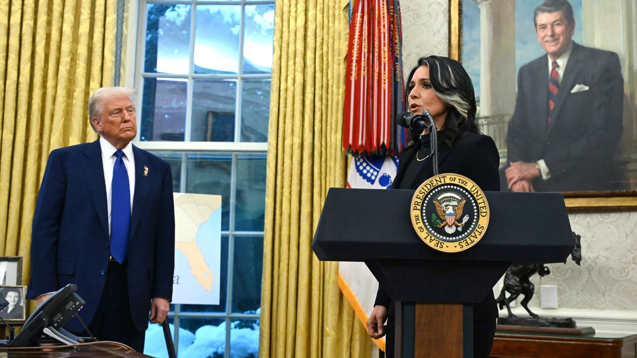 Director of National Intelligence Tulsi Gabbard, with US President Donald Trump, speaks after she was sworn in the Oval Office of the White House in Washington, on Feb. 12, 2025.