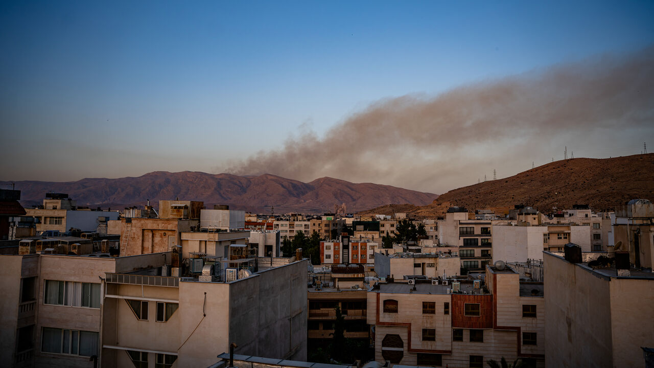 Smoke rises as fire burns, in an alleged site of IRGC's missile launch targeted by Israel on the mountains of Shiraz, Iran, June 21, 2025.