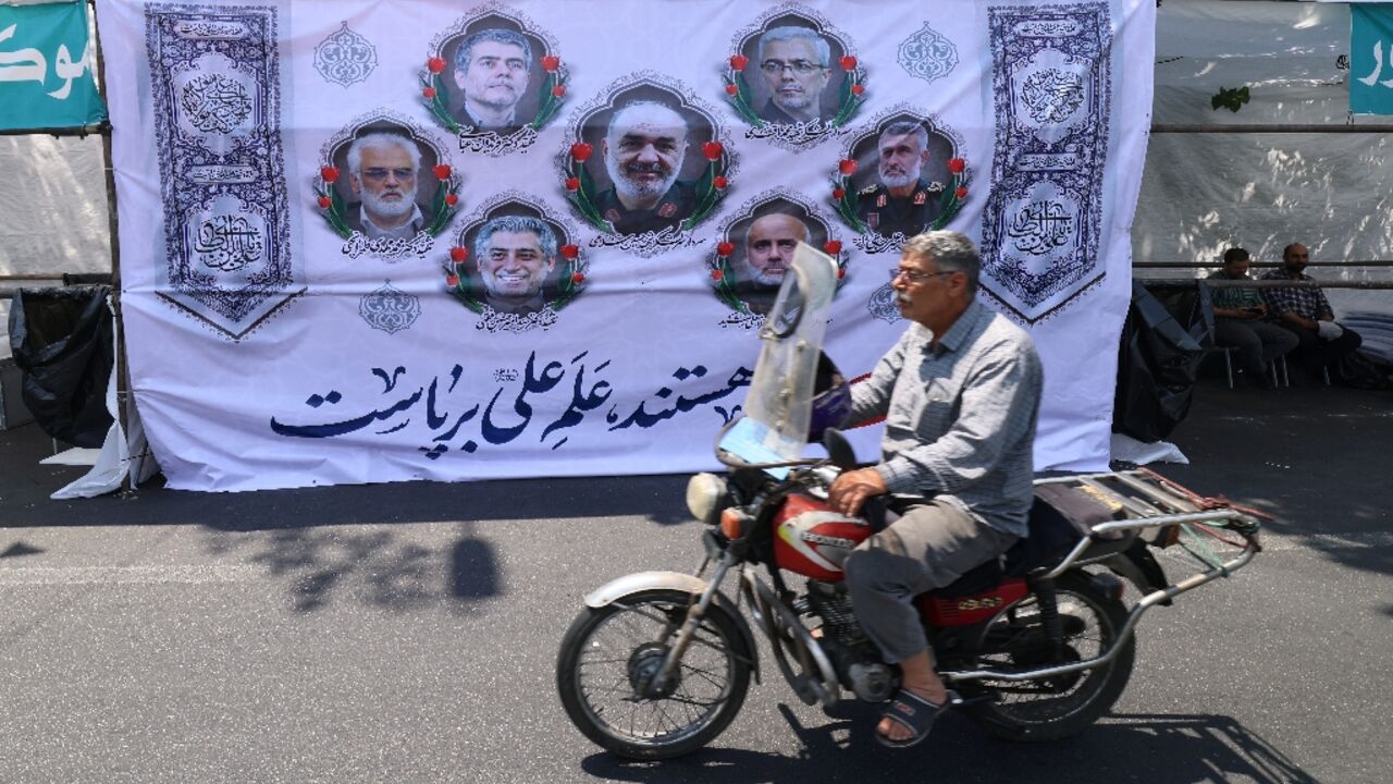 Portraits of Iranian military generals and nuclear scientists killed in Israel's attack early on June 13