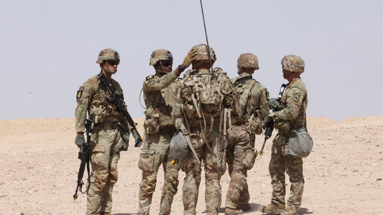 US military personnel participate in a Best Squad Competition at the Buehring base in Udairi, in Kuwait, on May 10, 2023