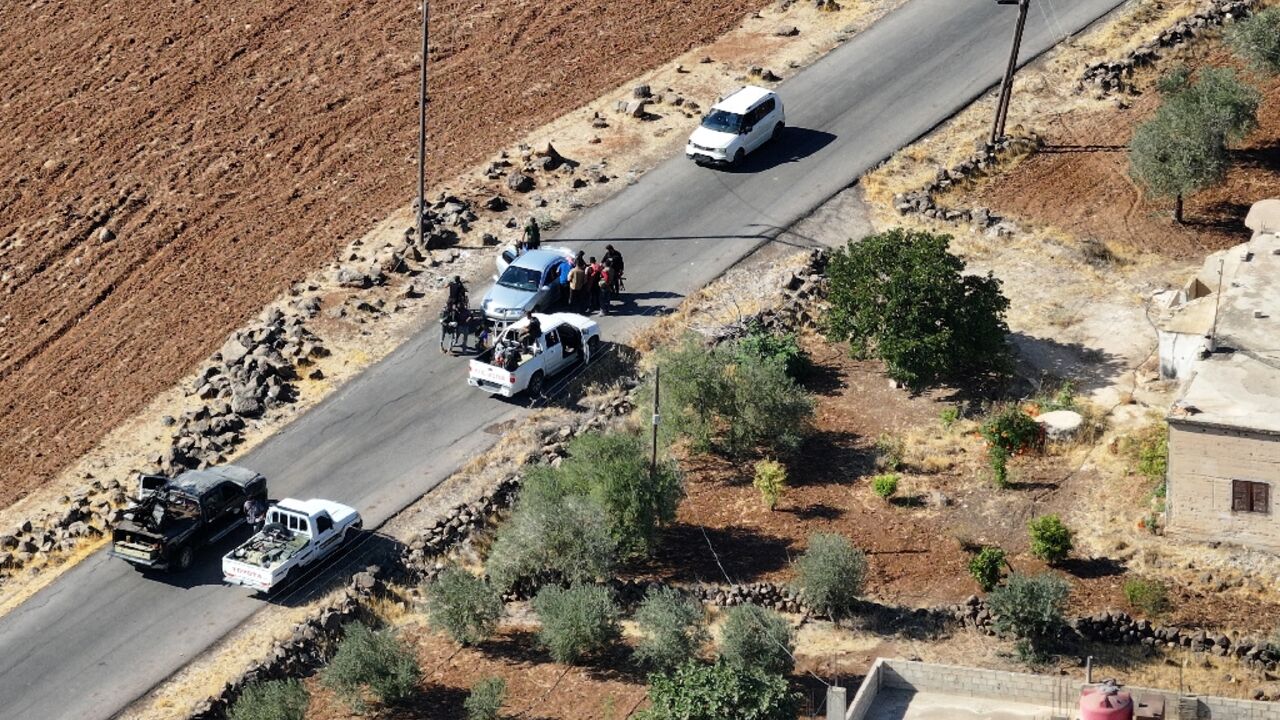 Druze gunmen deploy in the Sweida province village of Al-Dur after government troops pulled out before dawn.