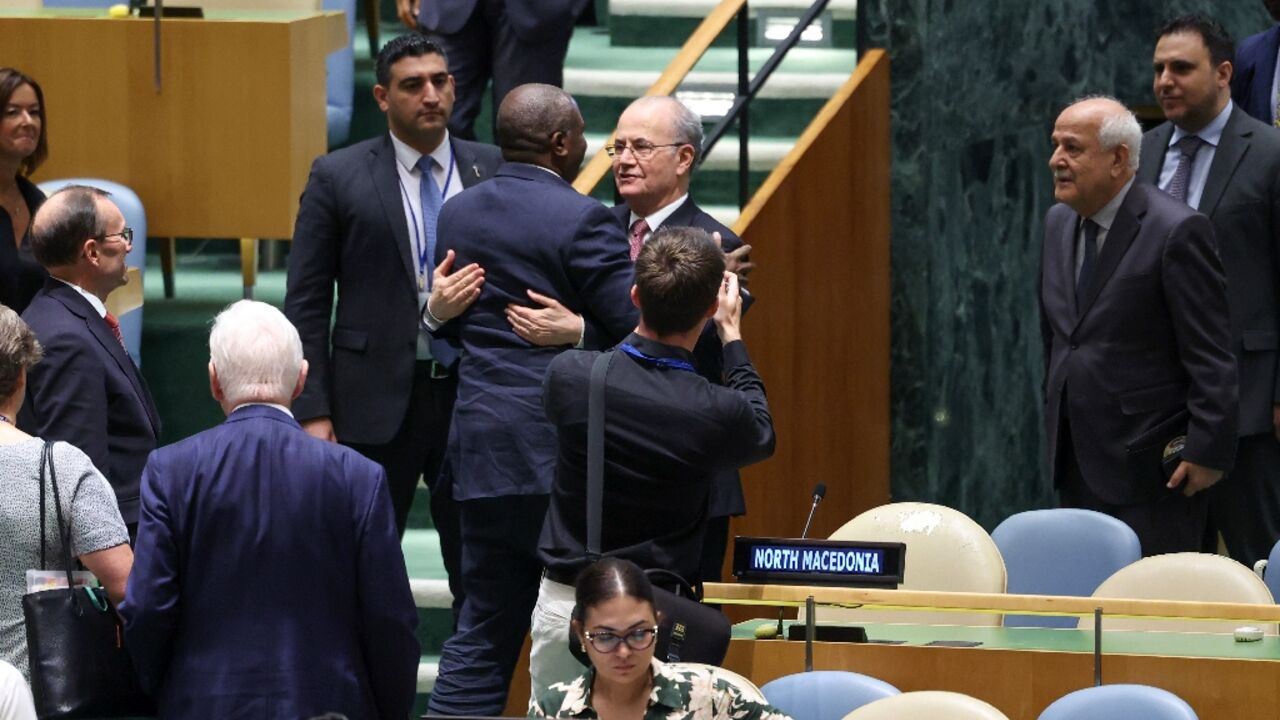 British Foreign Secretary David Lammy embraces Palestinian Prime Minister Mohammad Mustafa 