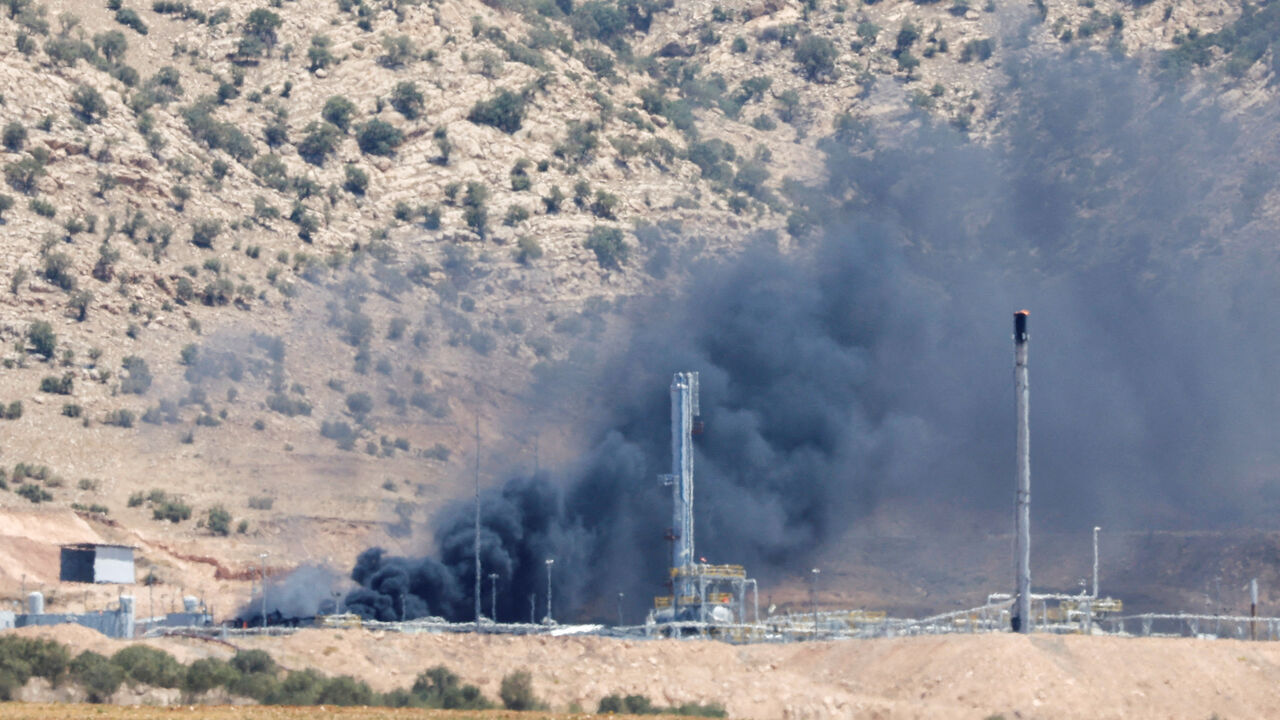 FILE PHOTO: Smoke rises after a drone attack targeted oil facilities in the Zakho area of Iraq's Kurdistan region, Iraq July 16, 2025. REUTERS/Khalid Al-Mousily/File Photo