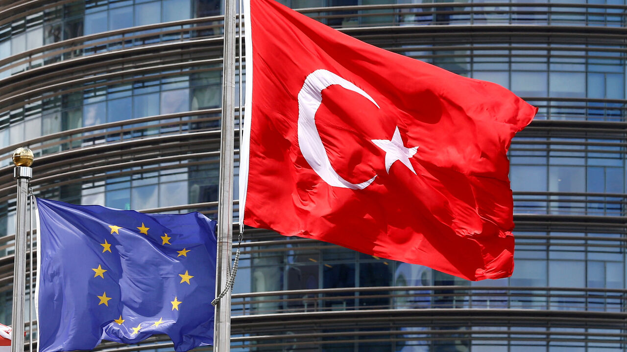 FILE PHOTO: A European Union (L) and Turkish flag fly outside a hotel in Istanbul, Turkey, May 4, 2016.  REUTERS/Murad Sezer/File Photo