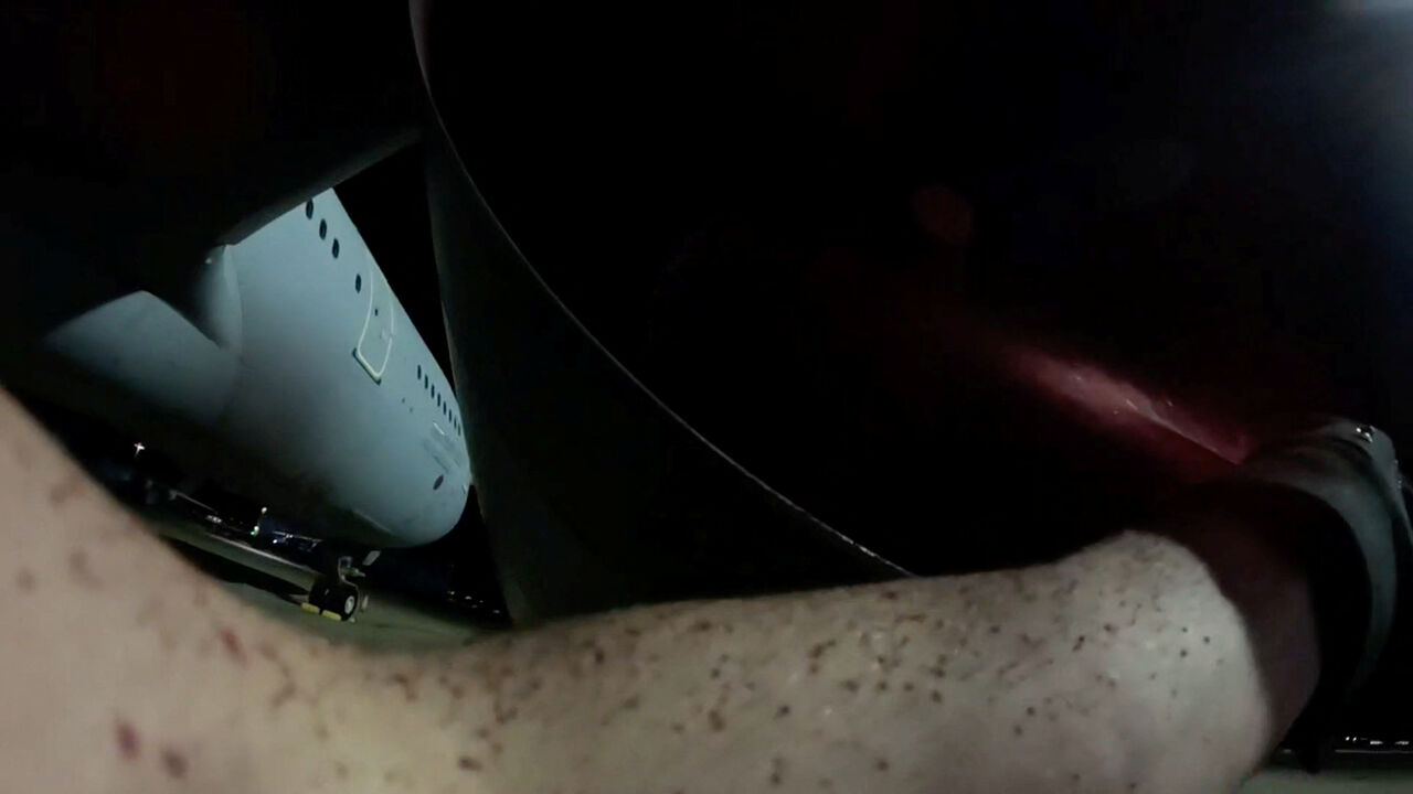 FILE PHOTO: An activist from Palestine Action sprays a military aircraft engine with red paint at RAF Brize Norton, to damage it, in Carterton, Britain, June 20, 2025, in this still image obtained from handout video. The group's action was in protest of British military assistance to Israel, claiming that they, "interrupted Britain's direct participation in the commission of genocide and war crimes across the Middle East", stating on their website. Palestine Action/Handout via REUTERS/File Photo