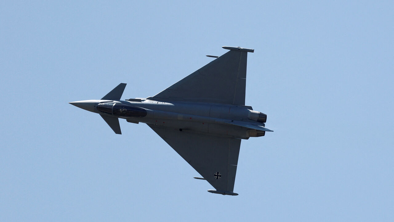 FILE PHOTO: A German Air Force Eurofighter Typhoon jet during an air display at the 55th International Paris Airshow at Le Bourget Airport near Paris, France, June 18, 2025. REUTERS/Benoit Tessier/File Photo