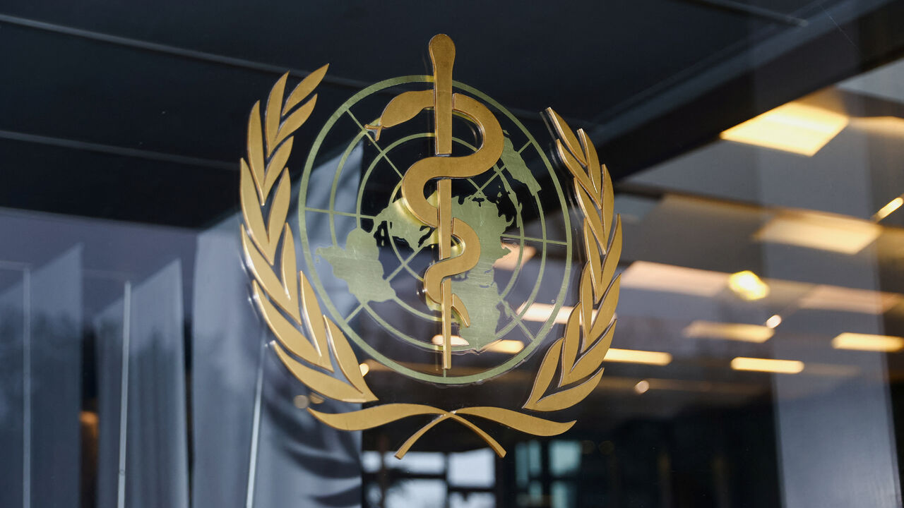 The World Health Organization logo is pictured at the entrance of the WHO building, in Geneva, Switzerland, December 20, 2021. REUTERS/Denis Balibouse/File Photo