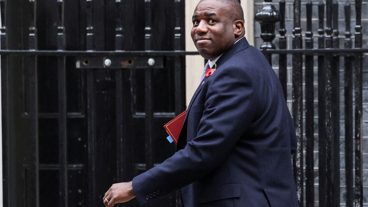 FILE PHOTO: Britain's Foreign Secretary David Lammy walks on Downing Street, on the day of the budget announcement, in London, Britain October 30, 2024. REUTERS/Isabel Infantes/File Photo