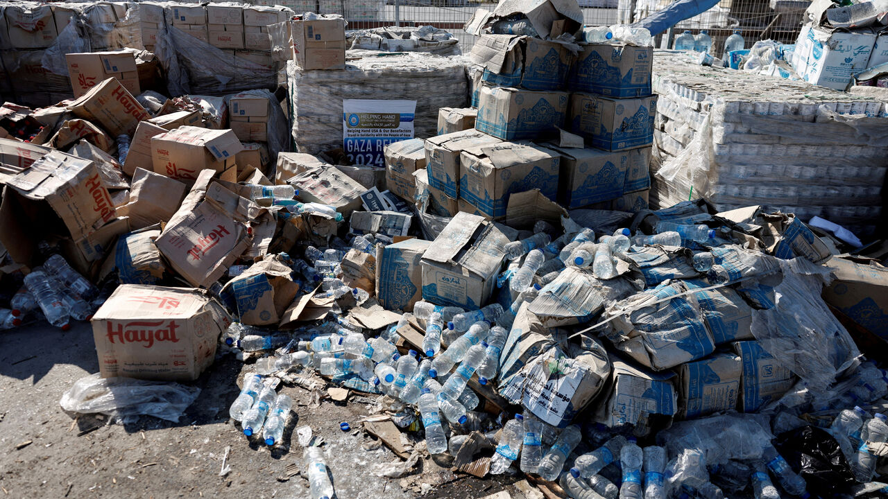 FILE PHOTO: Parcels of humanitarian aid await transfer into Gaza, at the Gaza side of the Kerem Shalom crossing in the Gaza Strip, July 24, 2025. REUTERS/Amir Cohen    EDITOR'S NOTE: REUTERS PHOTOGRAPHS WERE REVIEWED BY THE IDF AS PART OF THE CONDITIONS OF THE EMBED. NO PHOTOS WERE REMOVED./File Photo