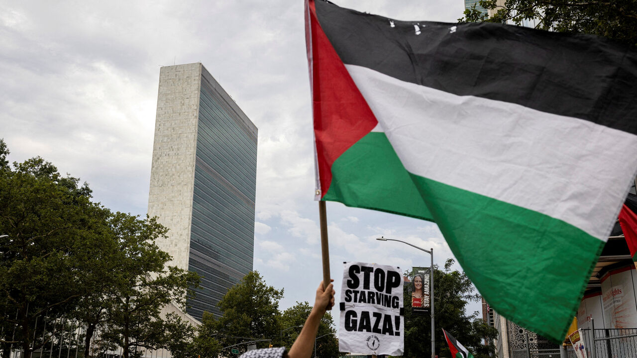 FILE PHOTO: People rally in front of the United Nations headquarters during a "Stop Starving Gaza Now" protest amid the ongoing conflict between Israel and Hamas, in New York City, U.S., July 25, 2025. REUTERS/Christian Monterrosa/File Photo