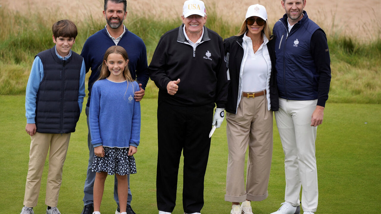 U.S. President Donald Trump poses for a photo with Donald Trump Jr., Eric Trump, Lara Trump and the president's grandchildren Tristan and Chloe after the opening ceremony for Trump International Golf Links near Aberdeen, Scotland, Britain July 29, 2025.  Alastair Grant/Pool via REUTERS