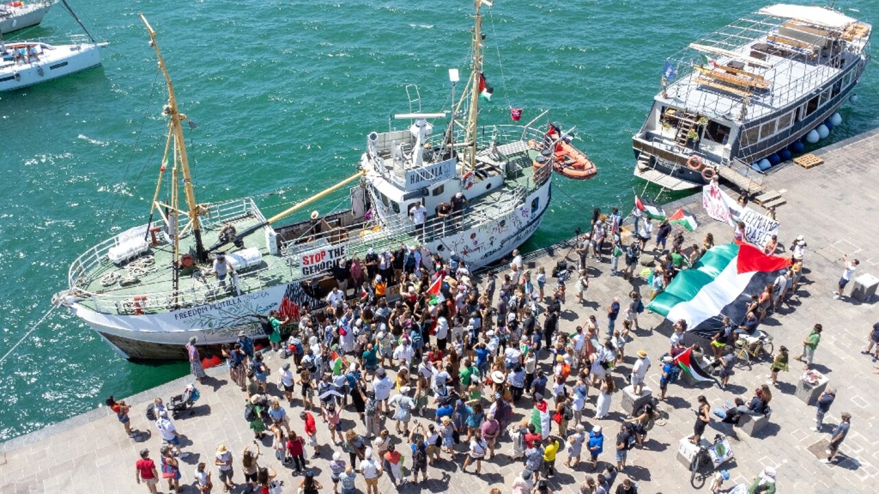 Pro-Palestinian activists gather on the dockside in Italy earlier this month to watch the Hamdala set sail for Gaza in a symbolic bid to breach Israel's blockade.