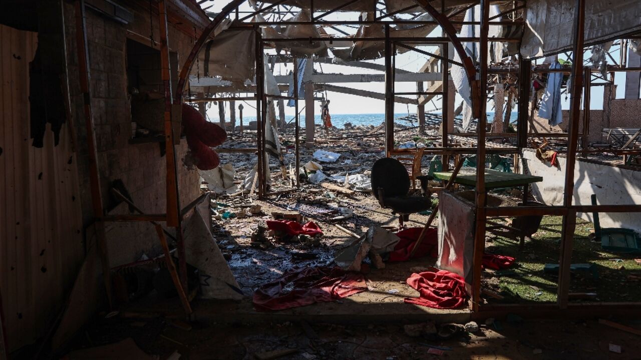 A seaside cafe near Gaza City lies in ruins after an Israeli strike that rescuers say killed 24 people