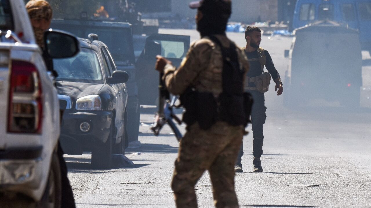 Syrian security forces deploy in the southern city of Sweida, where witnesses reported summary executions of Druze civilians