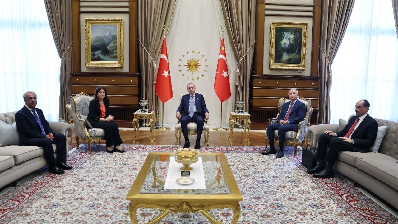 Turkey's President Recep Tayyip Erdogan (C) meets pro-Kurdish MPs at the presidential offices in Ankara, seeking to advance an emerging peace deal with Kurdish militants