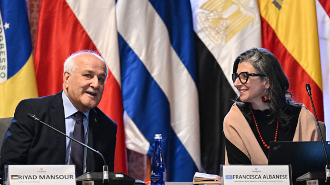 Francesca Albanese, United Nations Special Rapporteur on the situation of human rights in the Palestinian territories talks with UN Palestinian Ambassador Riyad Mansour during the emergency conference of The Hague Group at the San Carlos Palace in Bogota on July 15, 2025.