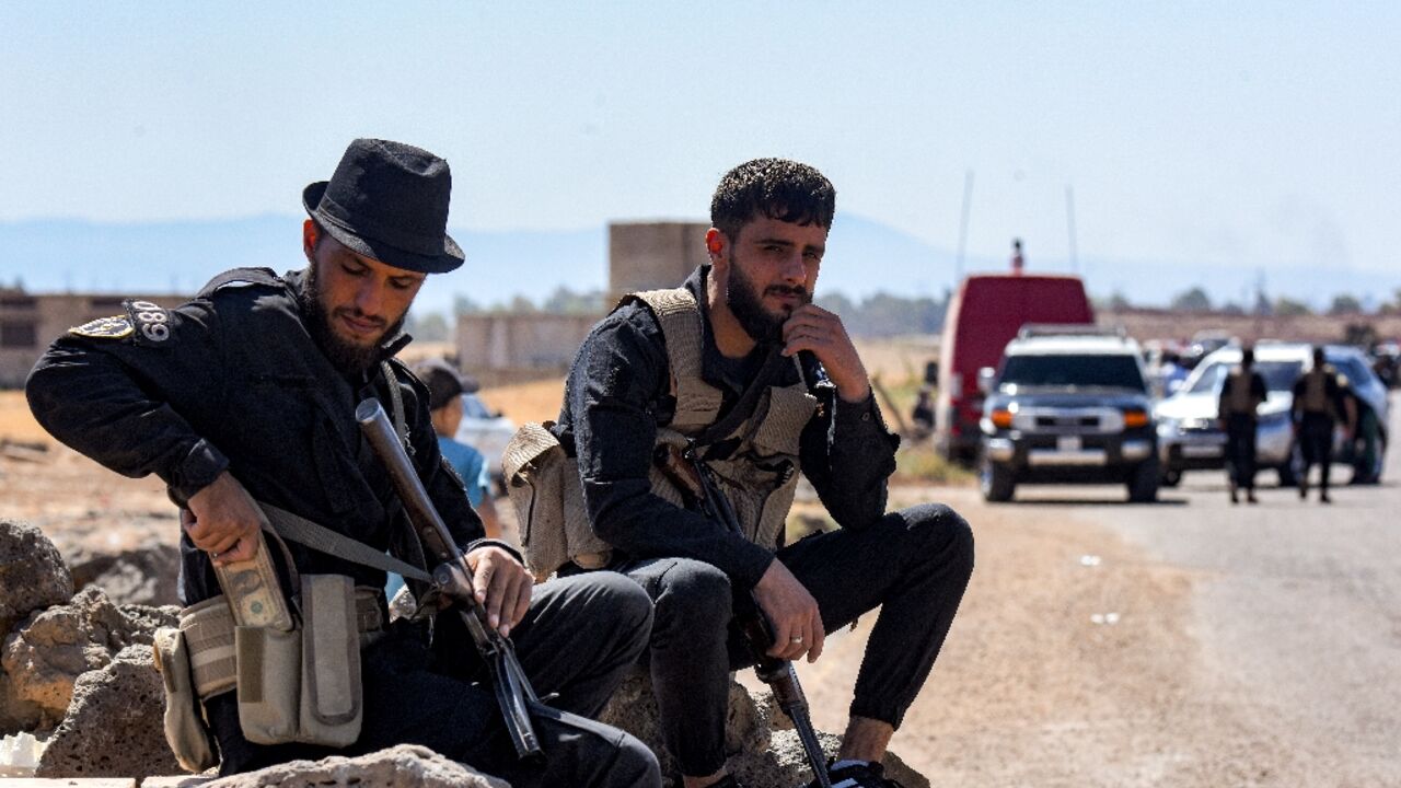 Security forces are seen during their deployment in Sweida in southern Syria