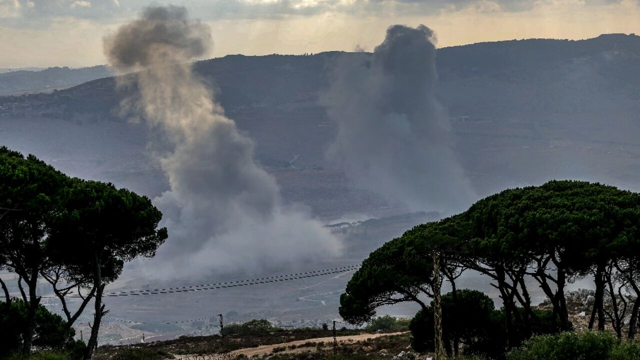 Smoke rises over the al-Khardali area of south Lebanon following an Israeli air strike.