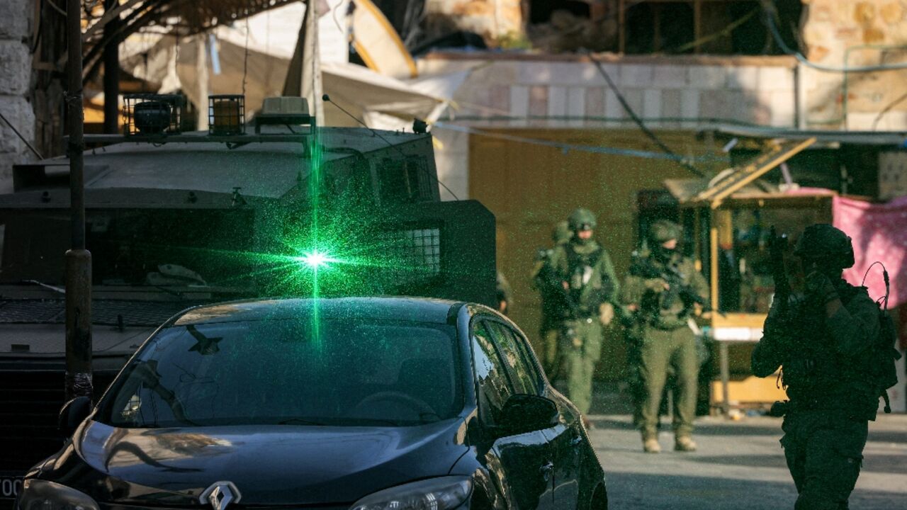 Israeli soldiers patrol the Palestinian city of Hebron in the occupied West Bank