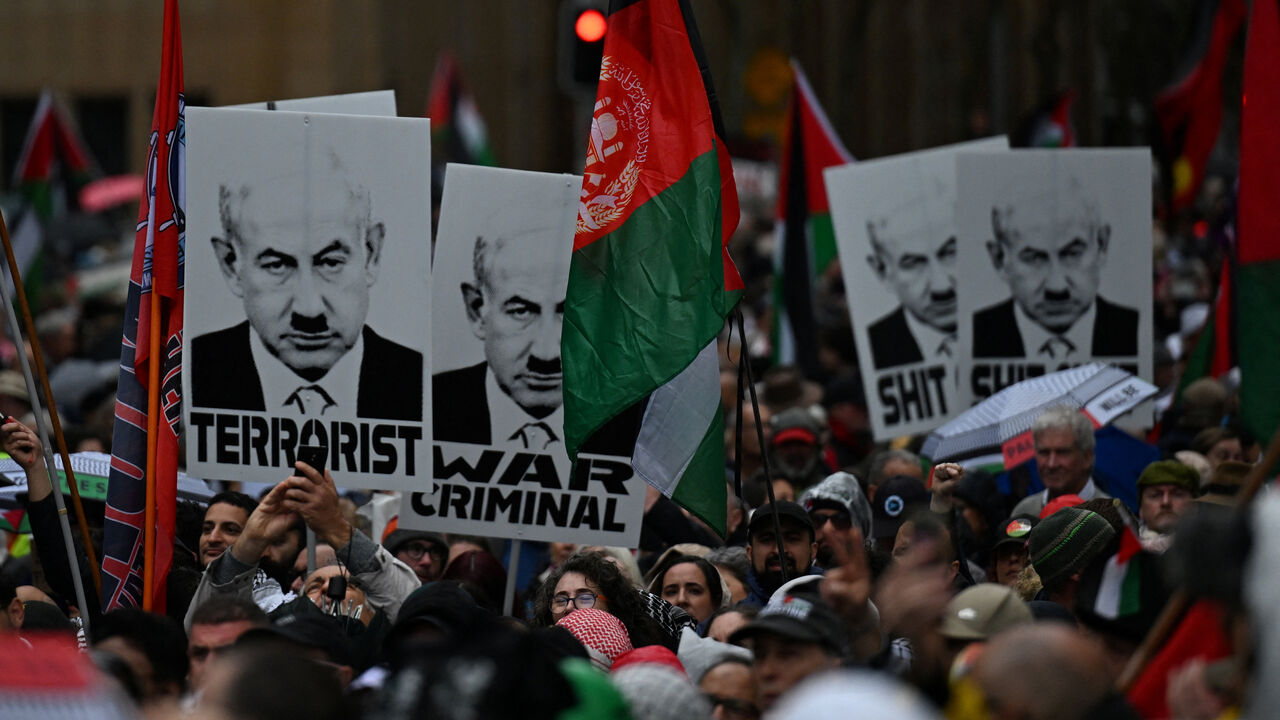Protesters gather to walk across the Sydney Harbour Bridge during the Palestine Action Group's March for Humanity in Sydney, Australia August 3, 2025. AAP/Dean Lewins via REUTERS